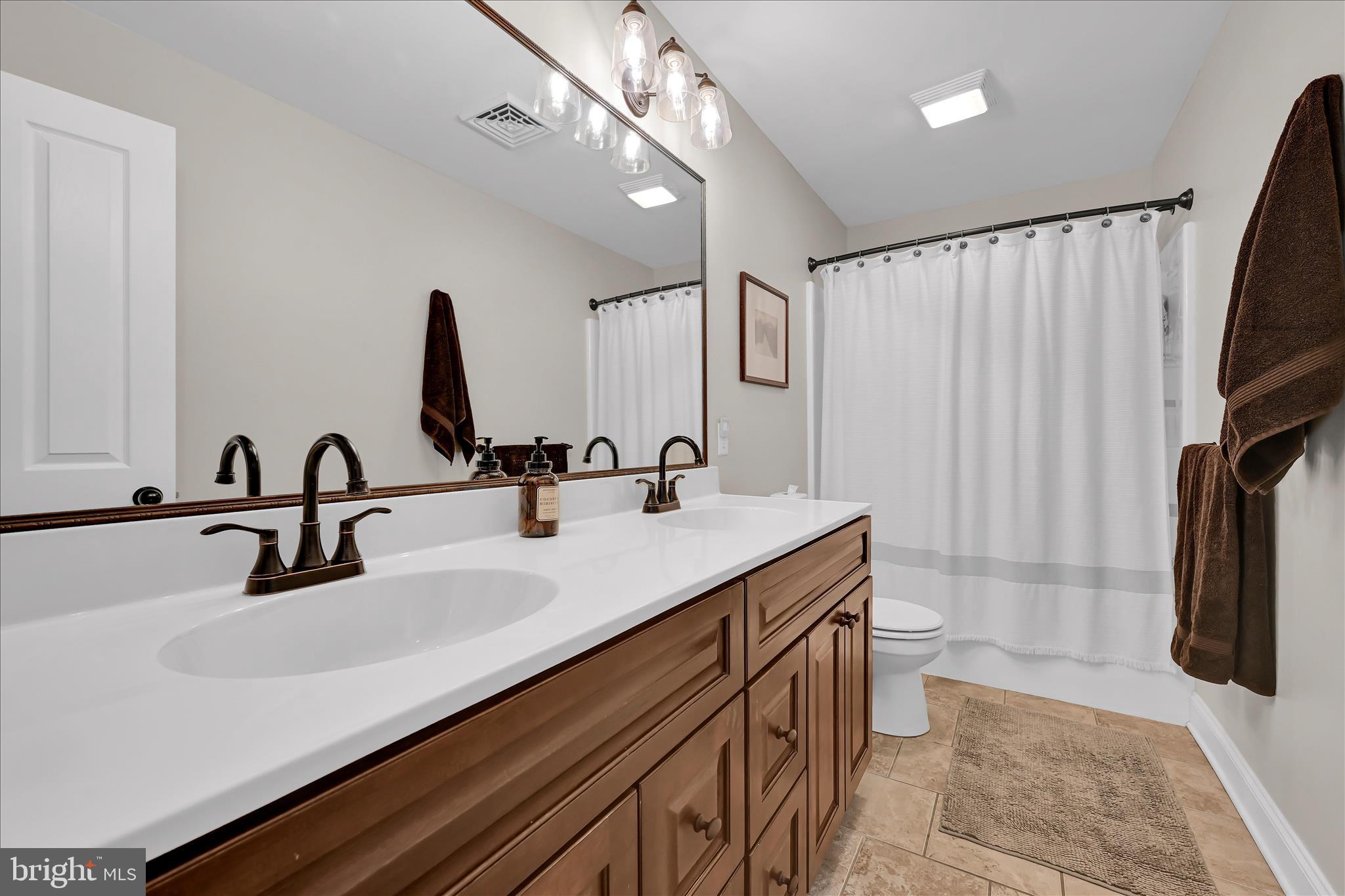 678 Integrity Drive Lititz, PA 17543 - Photo 27 of 51 a bathroom with a sink and a mirror