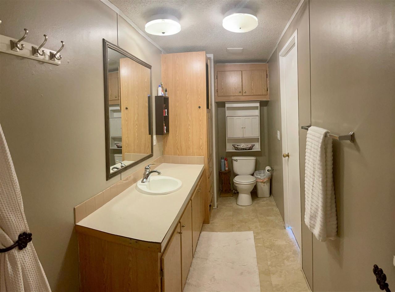 424 32 Road, Unit 335 Clifton, CO 81520 - Photo 13 of 18 a bathroom with a sink a toilet and shower
