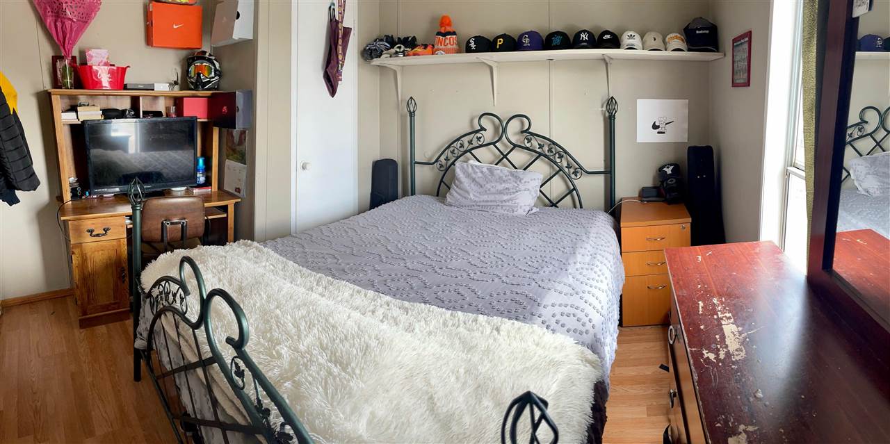424 32 Road, Unit 335 Clifton, CO 81520 - Photo 14 of 18 a bedroom with a bed and a flat tv screen on dresser