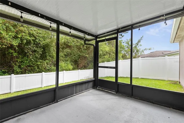 a view of an empty room with a large window
