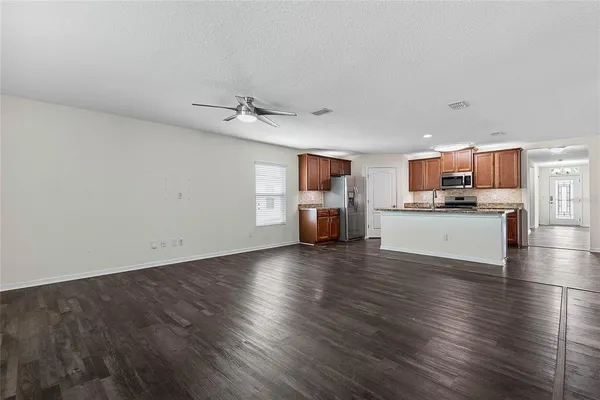 a view of kitchen and wooden floor