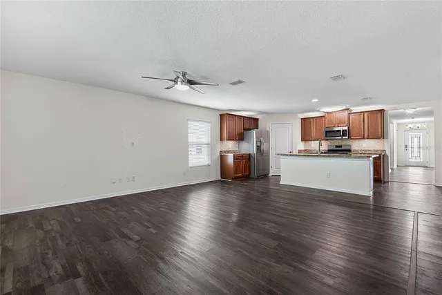 a view of kitchen and wooden floor