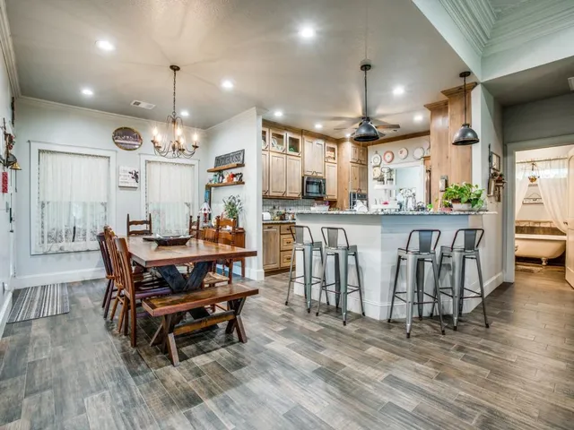 a living room with kitchen island furniture and a wooden floor