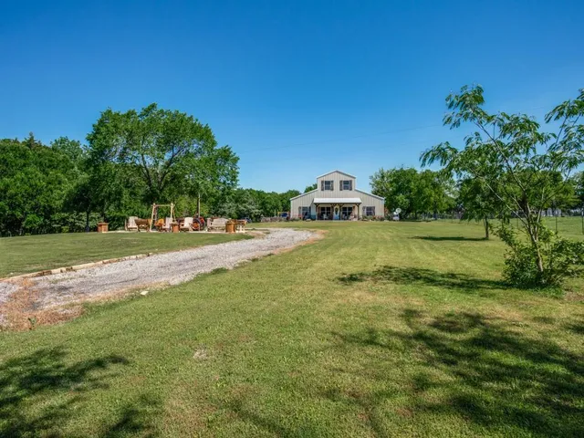 a view of yard with tree and green space