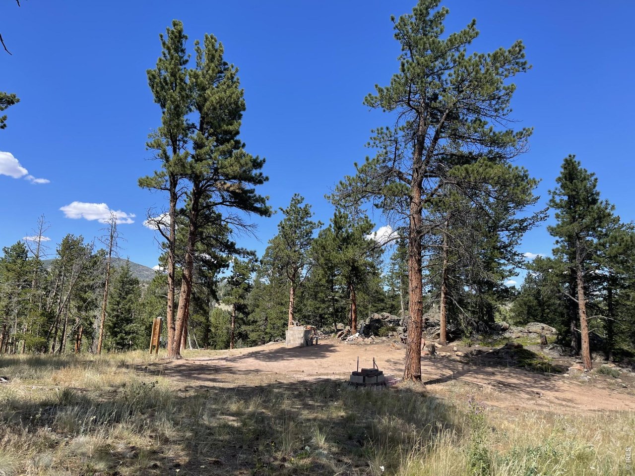 34 Shawnee Road Red Feather Lakes, CO 80545 - Photo 1 of 31 Large, level clearing nestled up against a rock outcropping makes the ideal camping spot.