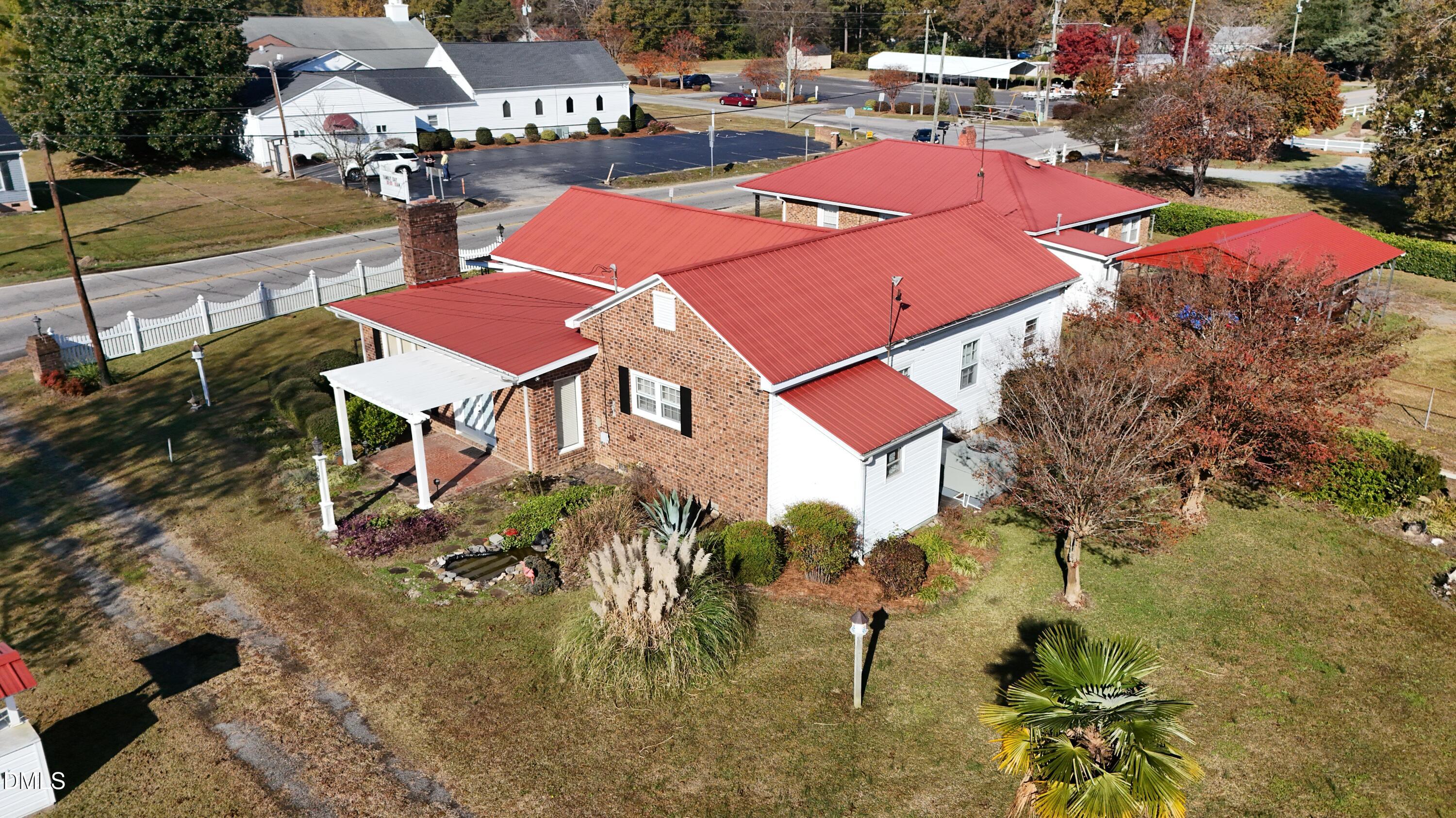 an aerial view of a house with a swimming pool