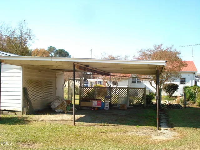 a view of a blue house with a large window