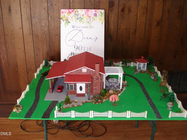 a view of a fountain in front of the house