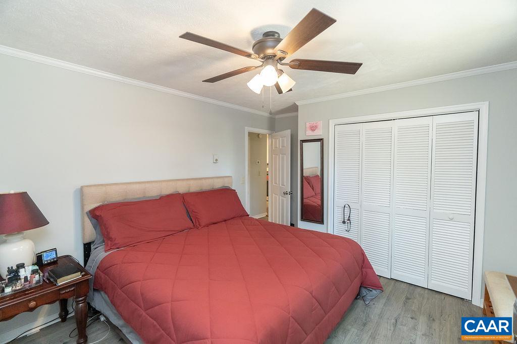 6920 Albevanna Spring Road Scottsville, VA 24590 - Photo 24 of 47 a bed room with a bed and a ceiling fan