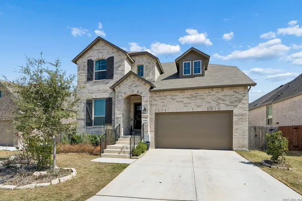 a front view of a house with yard