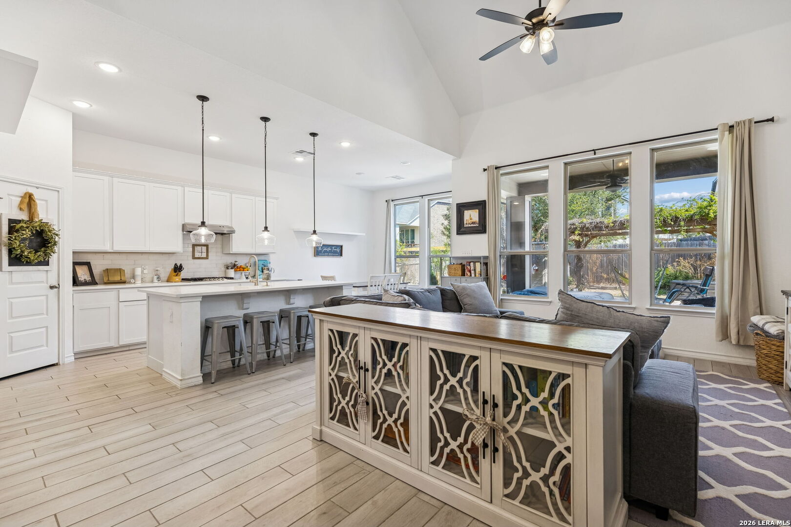 12260 Buckaroo Ranch San Antonio, TX 78254 - Photo 13 of 45 a open kitchen with stainless steel appliances granite countertop a stove and a wooden floors
