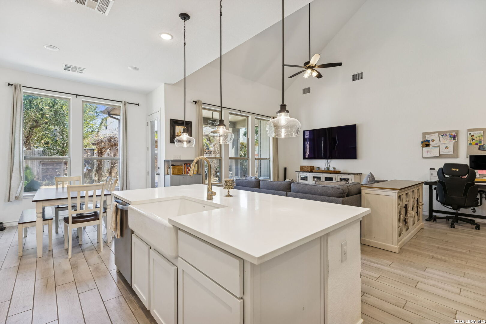 12260 Buckaroo Ranch San Antonio, TX 78254 - Photo 16 of 45 a kitchen with a stove a sink dishwasher and a refrigerator with wooden floor