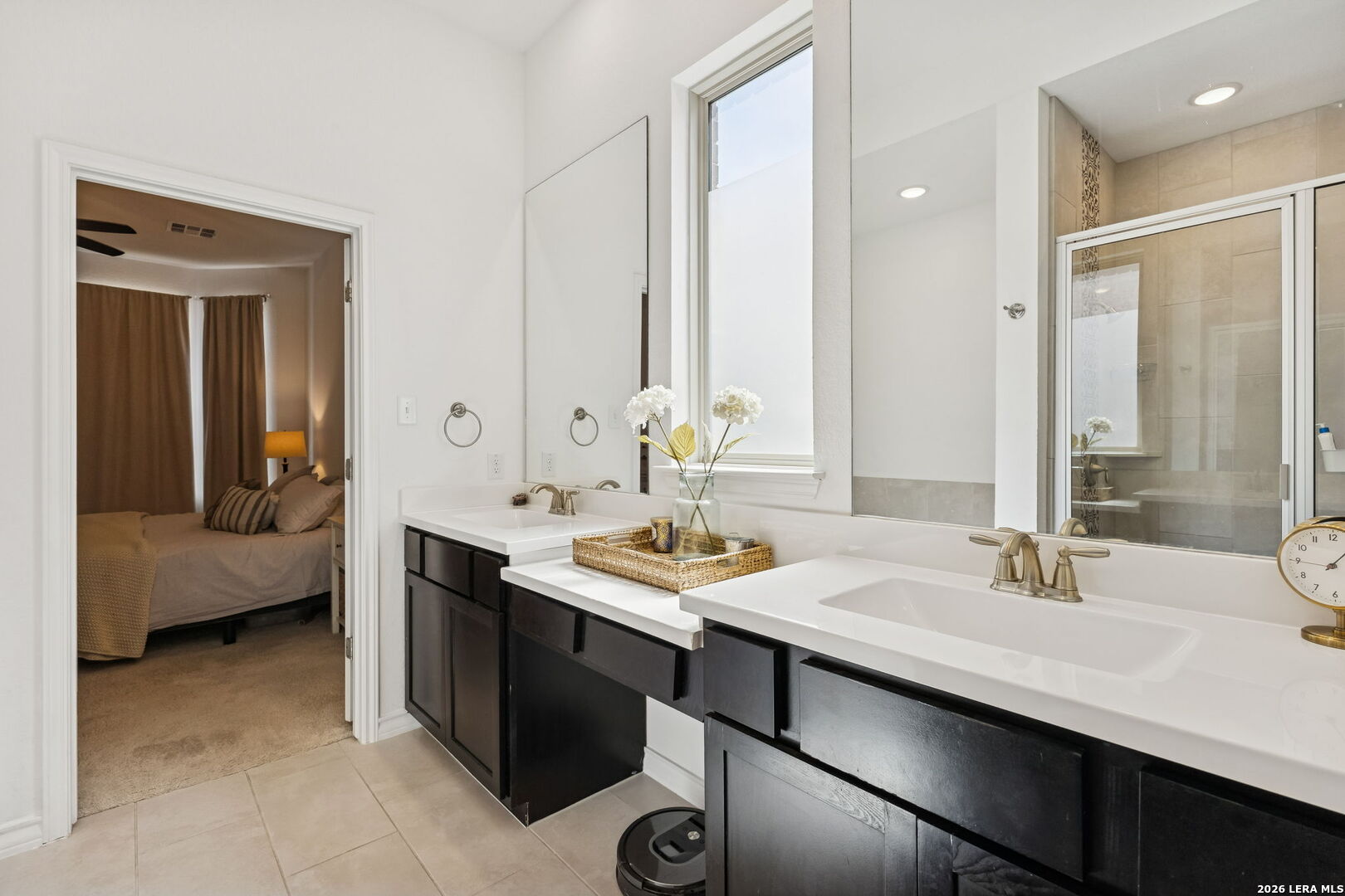 12260 Buckaroo Ranch San Antonio, TX 78254 - Photo 23 of 45 a bathroom with a sink double vanity and a mirror
