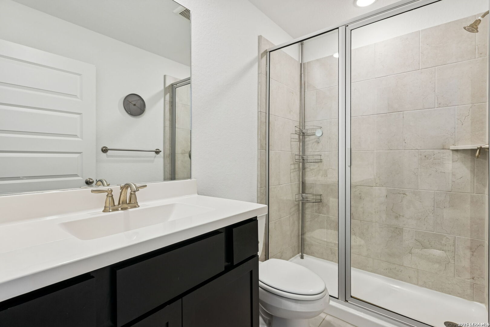 12260 Buckaroo Ranch San Antonio, TX 78254 - Photo 28 of 45 a bathroom with a sink a toilet and shower