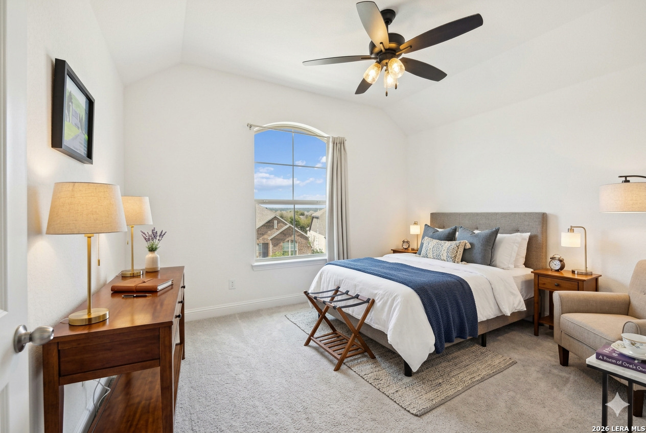 12260 Buckaroo Ranch San Antonio, TX 78254 - Photo 29 of 45 a spacious bedroom with a bed and a window
