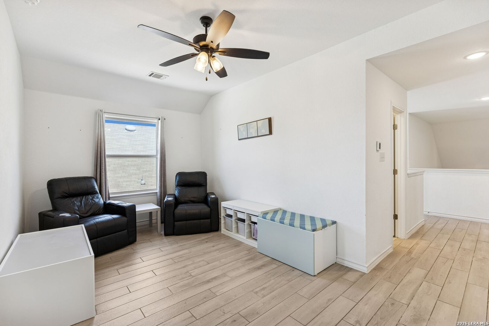 12260 Buckaroo Ranch San Antonio, TX 78254 - Photo 31 of 45 a living room with furniture and a wooden floor