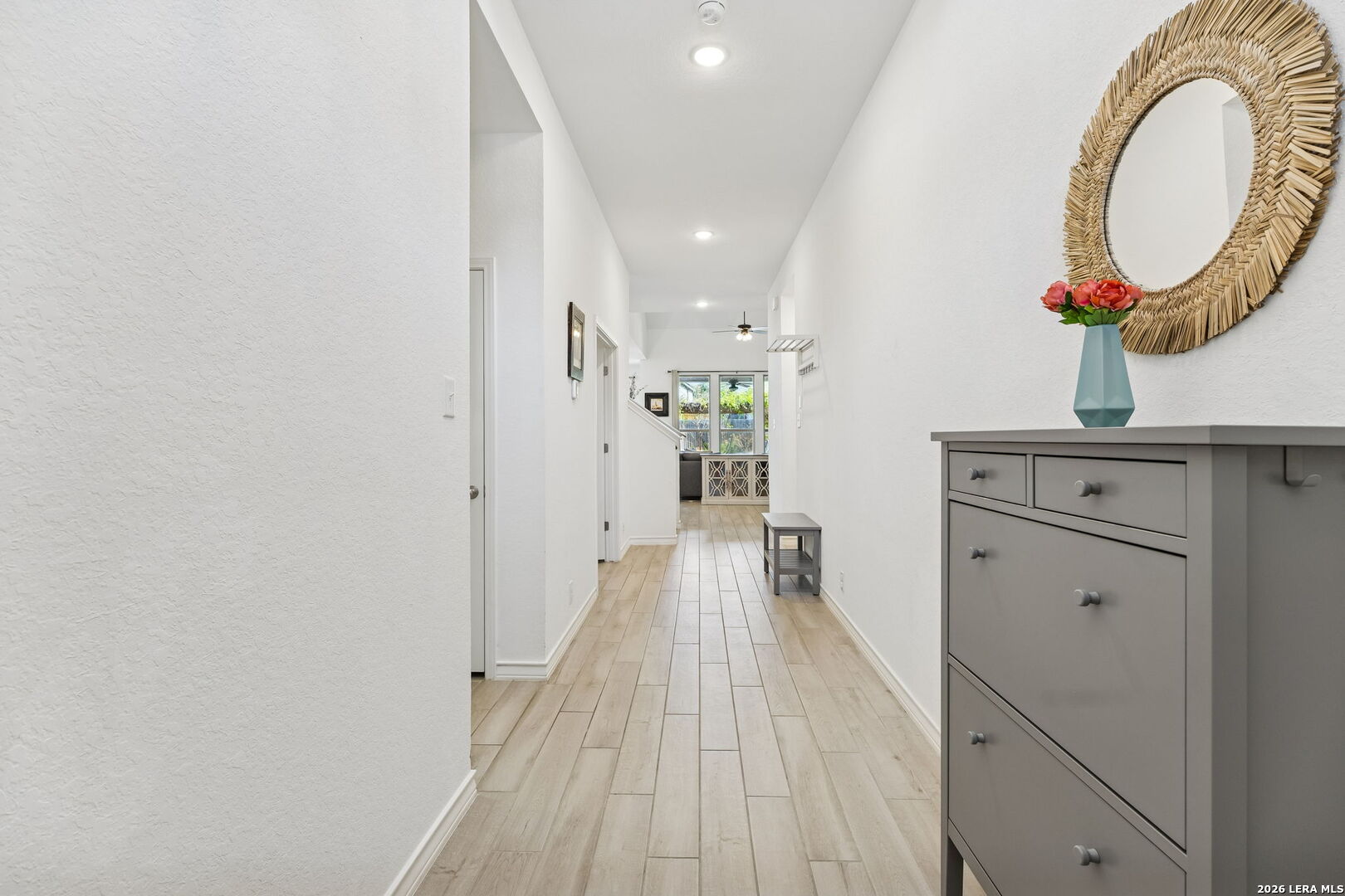 12260 Buckaroo Ranch San Antonio, TX 78254 - Photo 8 of 45 a view of a kitchen with a sink and a wooden floor