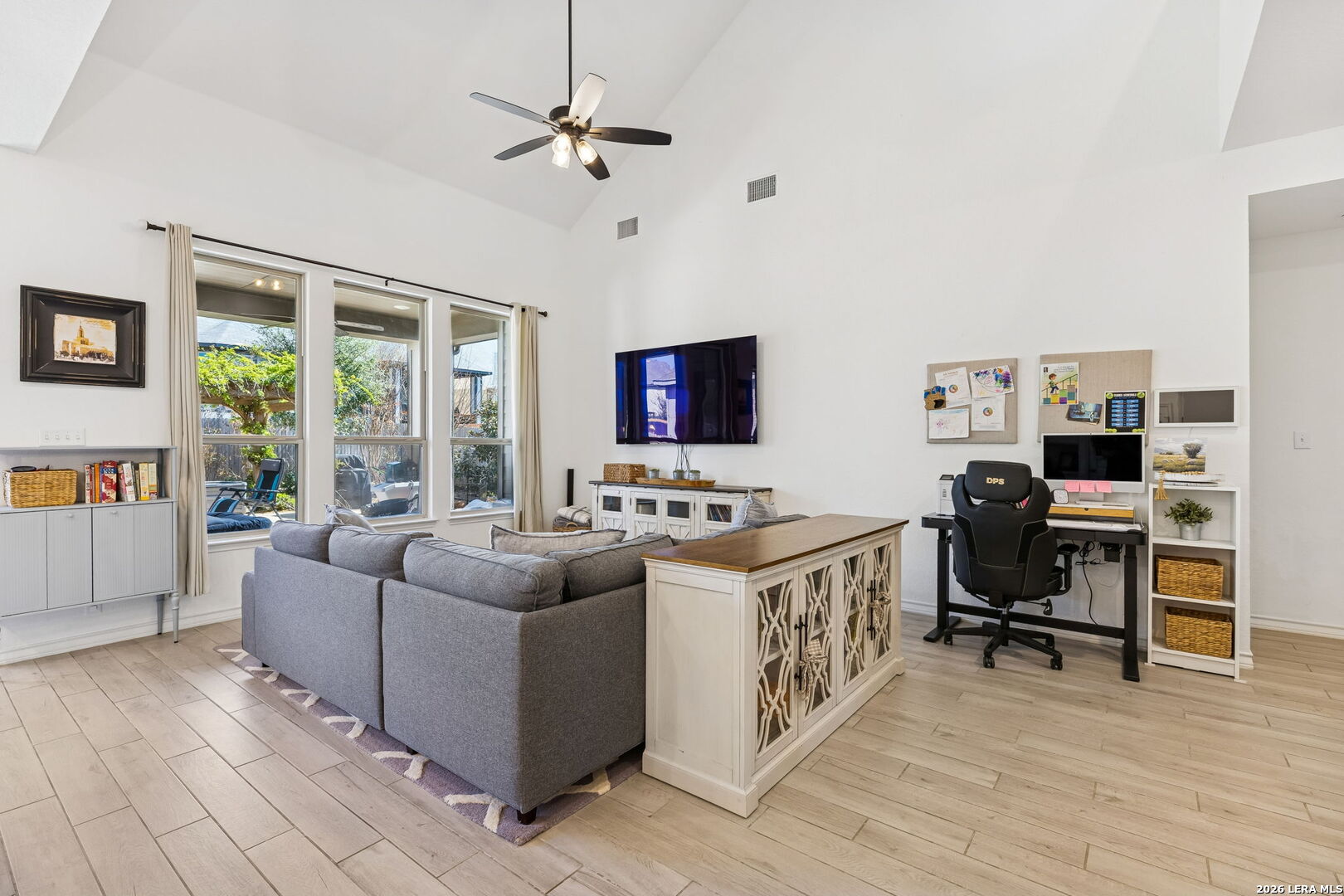 12260 Buckaroo Ranch San Antonio, TX 78254 - Photo 9 of 45 a living room with furniture and a flat screen tv