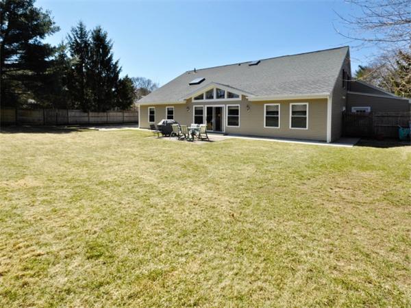 21 Appleton Road Natick, MA 01760 - Photo 21 of 25 a front view of house with yard and trees in the background