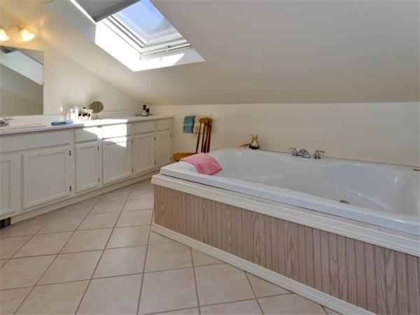 21 Appleton Road Natick, MA 01760 - Photo 25 of 25 a spacious bathroom with a sink a vanity and mirror