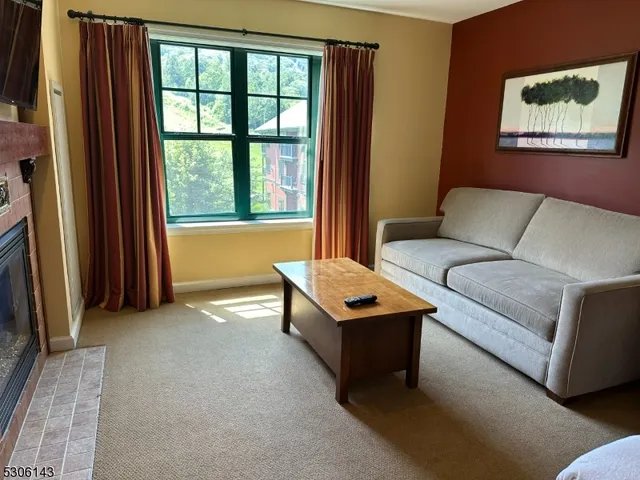a view of a patio with couches chairs and a fire pit