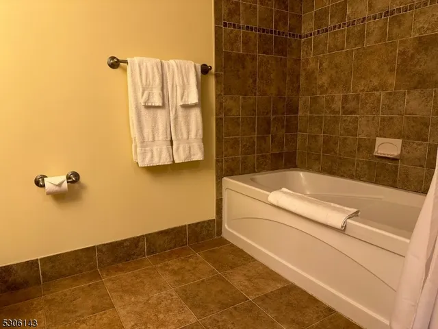 a view of a street with houses on the roadside