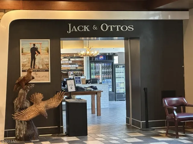 a living room with lots of furniture and a chandelier