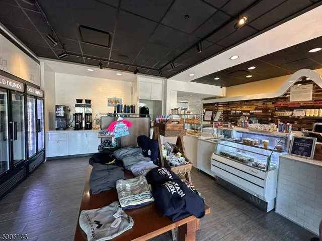 a kitchen with sink stove and refrigerator