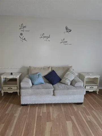 a living room with furniture and a couch