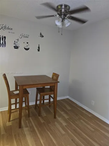 a workspace with furniture and wooden floor