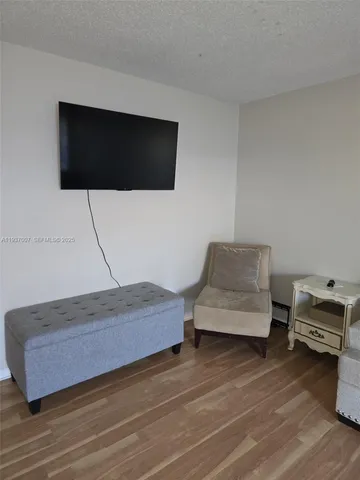 a living room with a couch and a flat screen tv