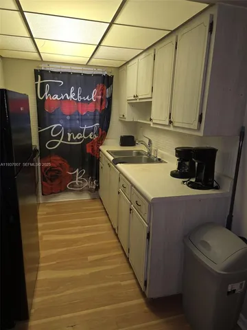 a kitchen with a sink and cabinets