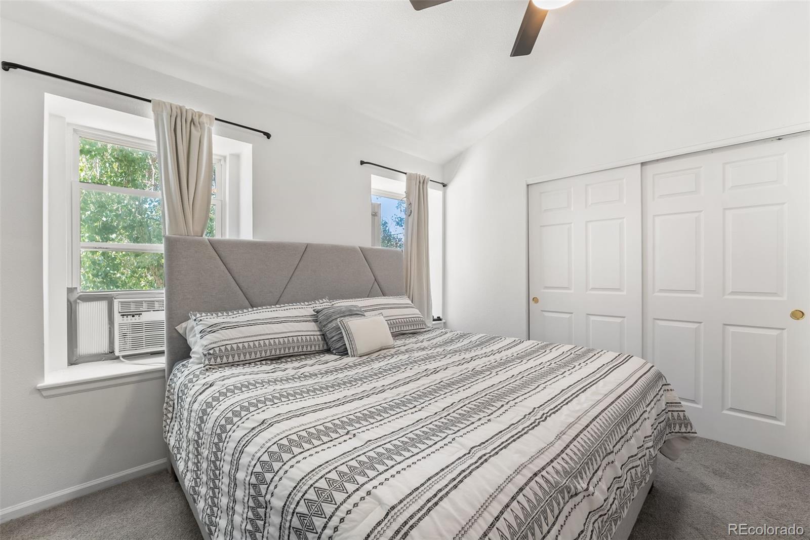 152 Pheasant Run Louisville, CO 80027 - Photo 16 of 30 a bedroom with a bed and a window