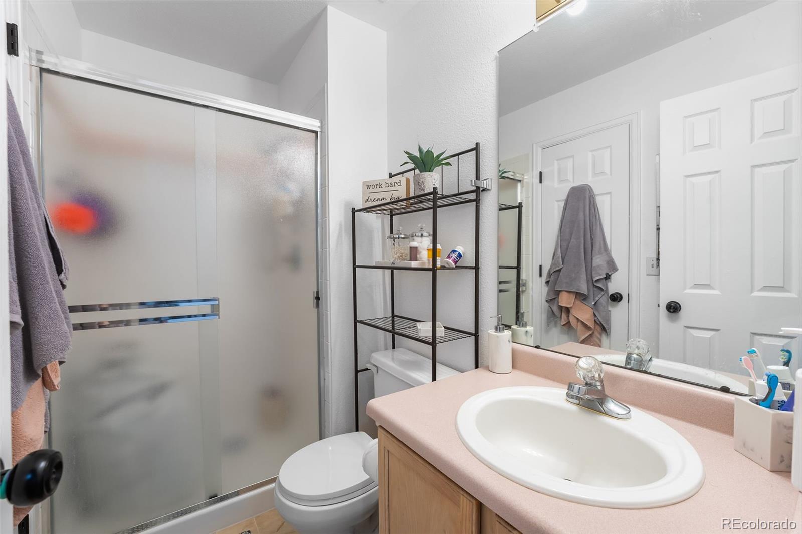 152 Pheasant Run Louisville, CO 80027 - Photo 18 of 30 a bathroom with a sink toilet and shower