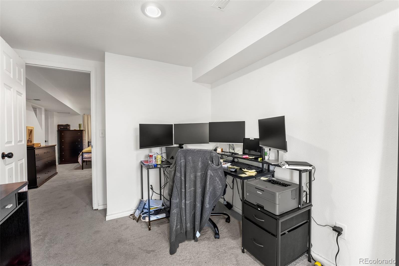 152 Pheasant Run Louisville, CO 80027 - Photo 26 of 30 a view of a livingroom with a flat screen tv and furniture