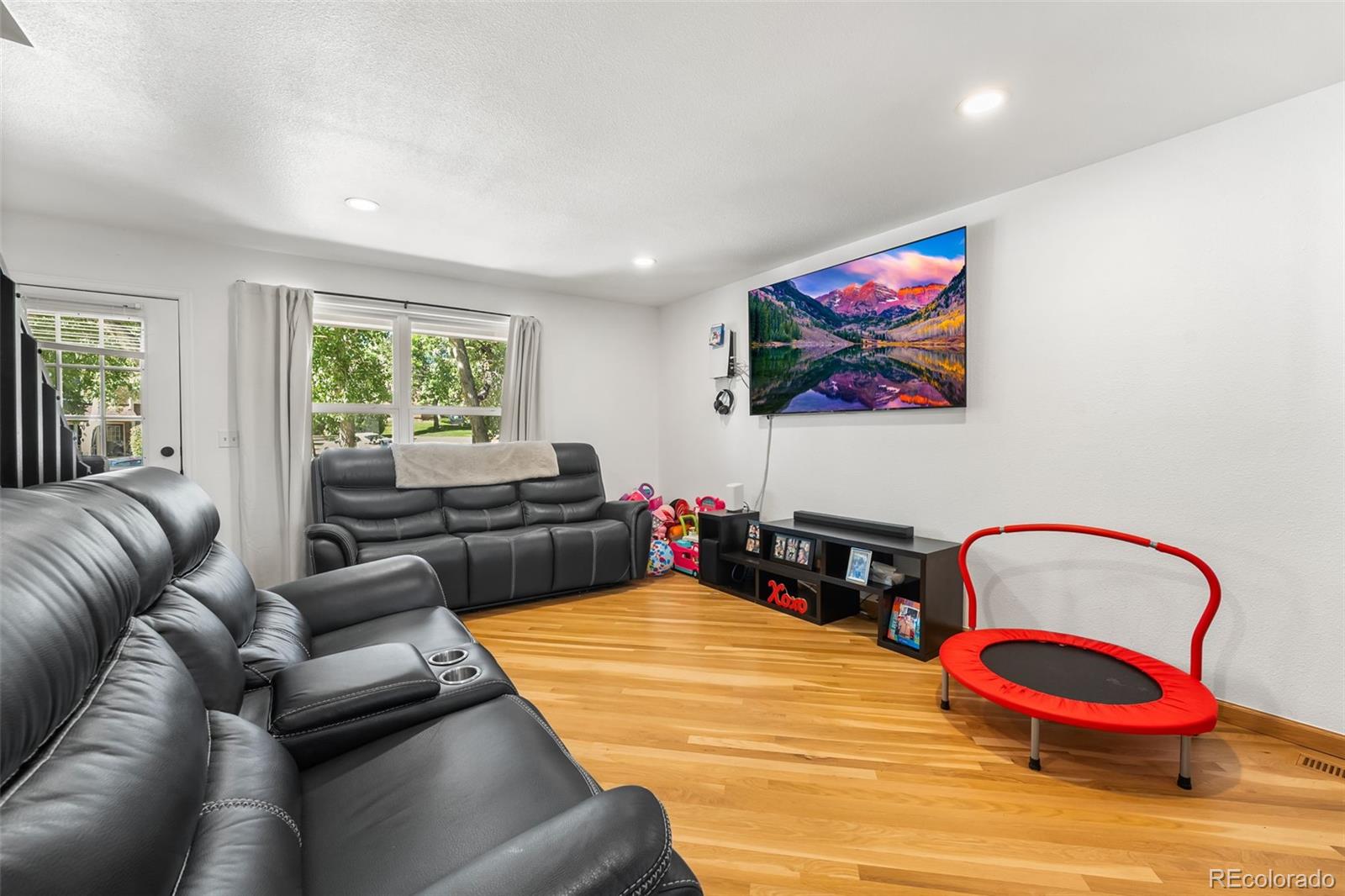 152 Pheasant Run Louisville, CO 80027 - Photo 9 of 30 a bedroom with furniture and wooden floor