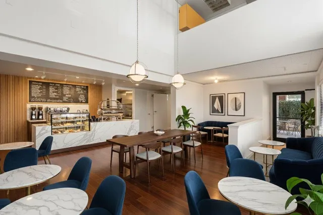 a living room with fireplace furniture and a wooden floor
