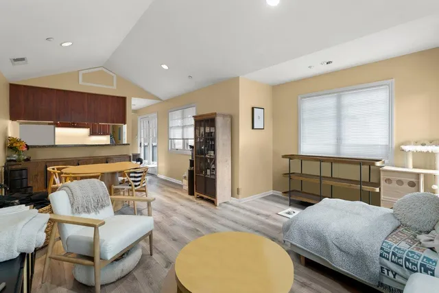 a bedroom with a bed and couch