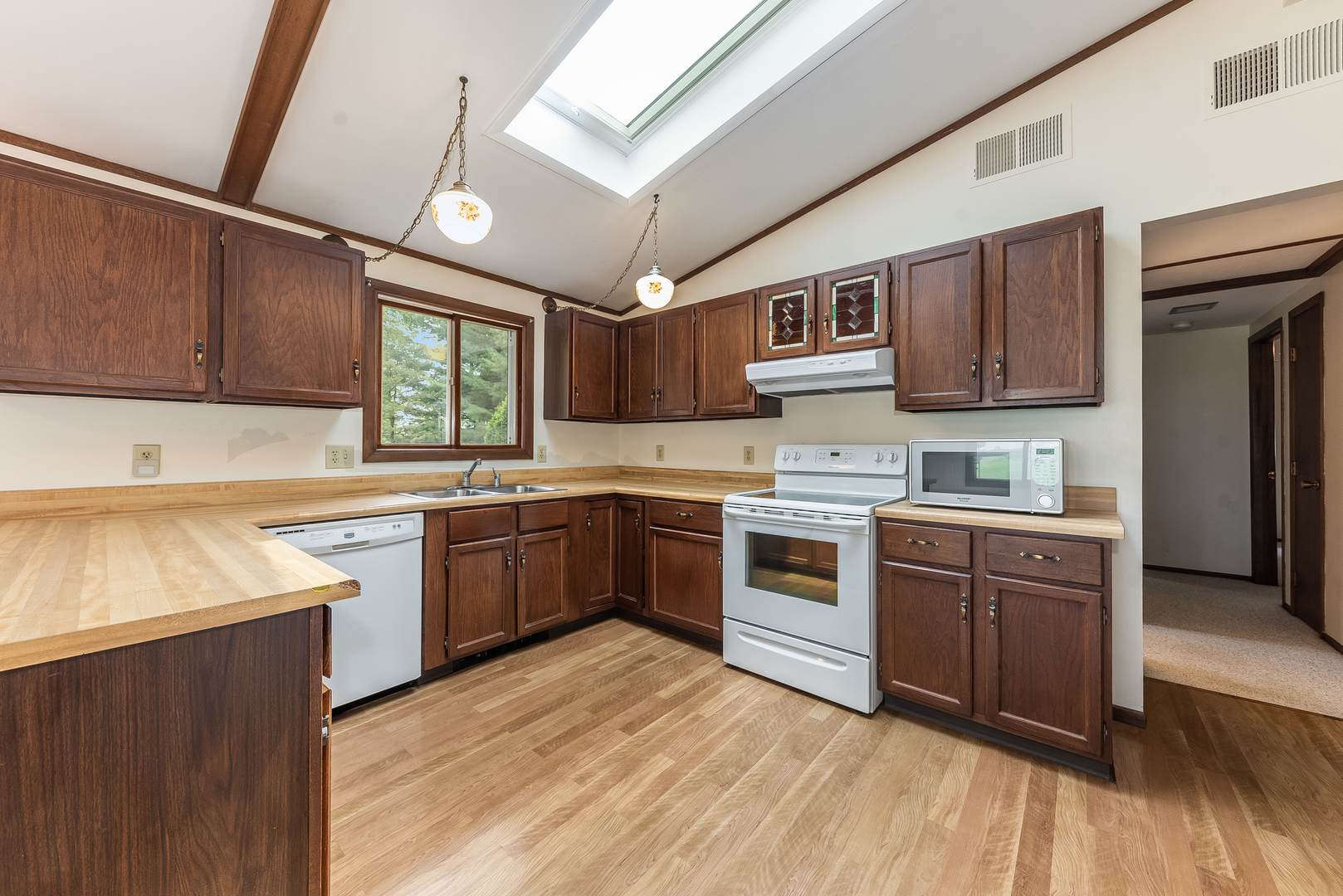 44W695 Scott Road Sugar Grove, IL 60554 - Photo 14 of 34 a kitchen with stainless steel appliances granite countertop a stove top oven a sink dishwasher and a refrigerator with wooden cabinets