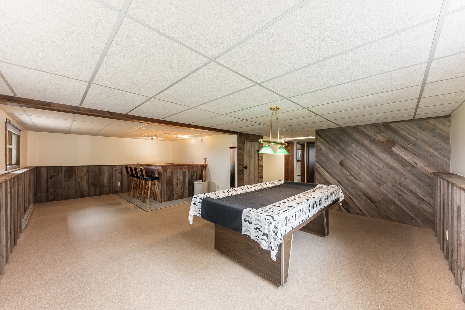 44W695 Scott Road Sugar Grove, IL 60554 - Photo 19 of 34 a spacious bedroom with a bed and a chandelier