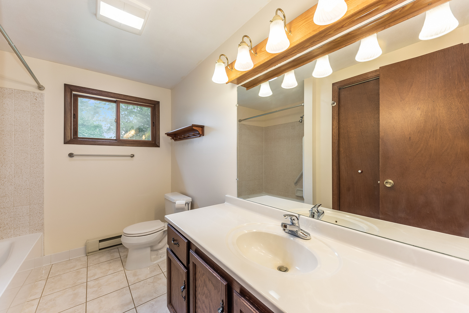 44W695 Scott Road Sugar Grove, IL 60554 - Photo 25 of 34 a bathroom with a sink a toilet and a mirror
