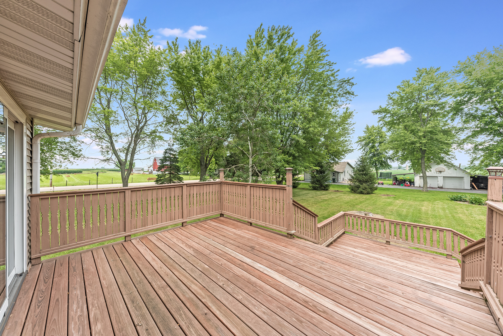 44W695 Scott Road Sugar Grove, IL 60554 - Photo 6 of 34 a view of a balcony with wooden floor and trees