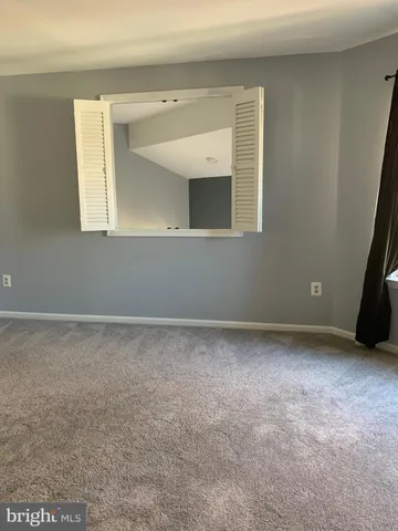a view of a bathroom from a hallway