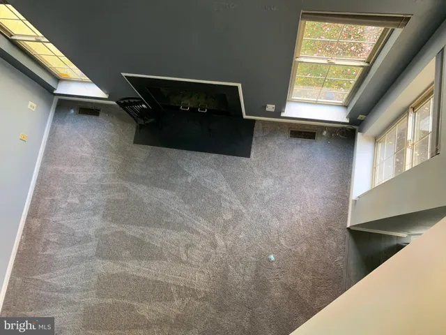 an empty room with closet area