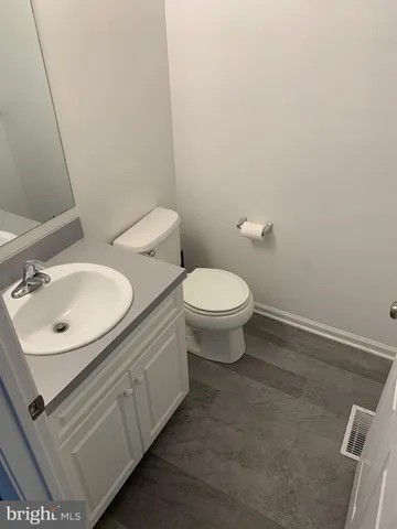 a view of an empty room and fire place