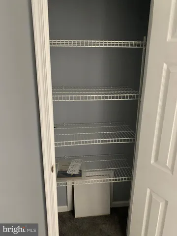 a view of small space with racks on the wall