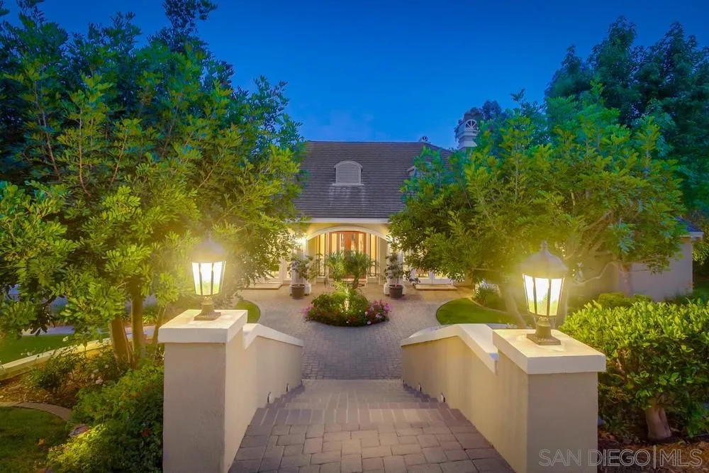6867 Poco Lago Rancho Santa Fe, CA 92067 - Photo 1 of 52 a view of a patio with couches and potted plants
