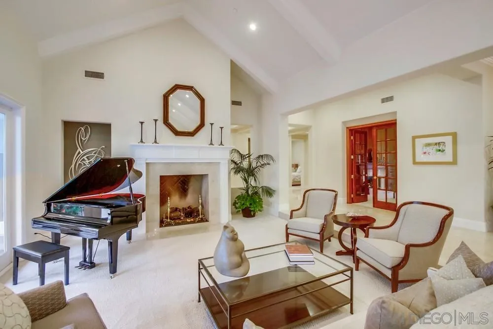 6867 Poco Lago Rancho Santa Fe, CA 92067 - Photo 19 of 52 a living room with furniture and a fireplace