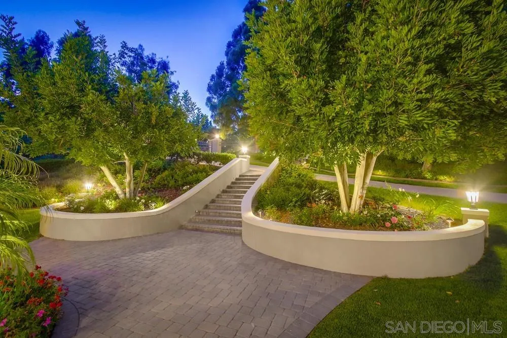 6867 Poco Lago Rancho Santa Fe, CA 92067 - Photo 8 of 52 a view of a swimming pool with a garden