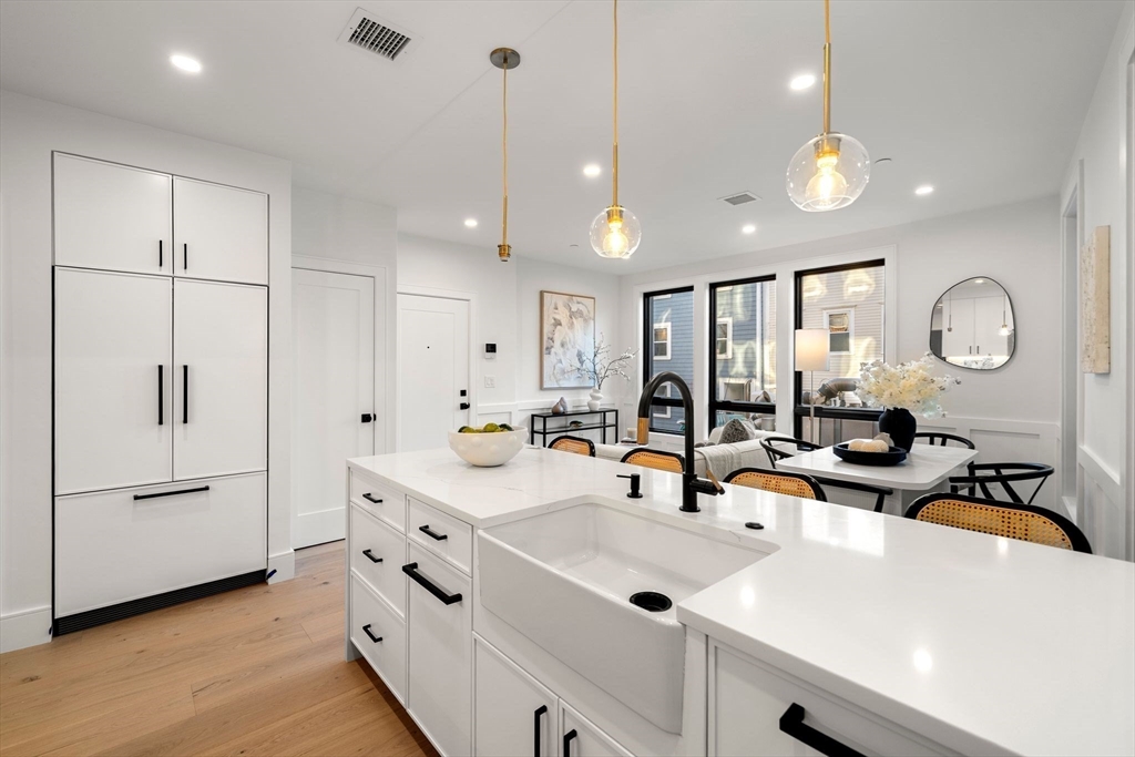 a kitchen with counter top space sink and stainless steel appliances